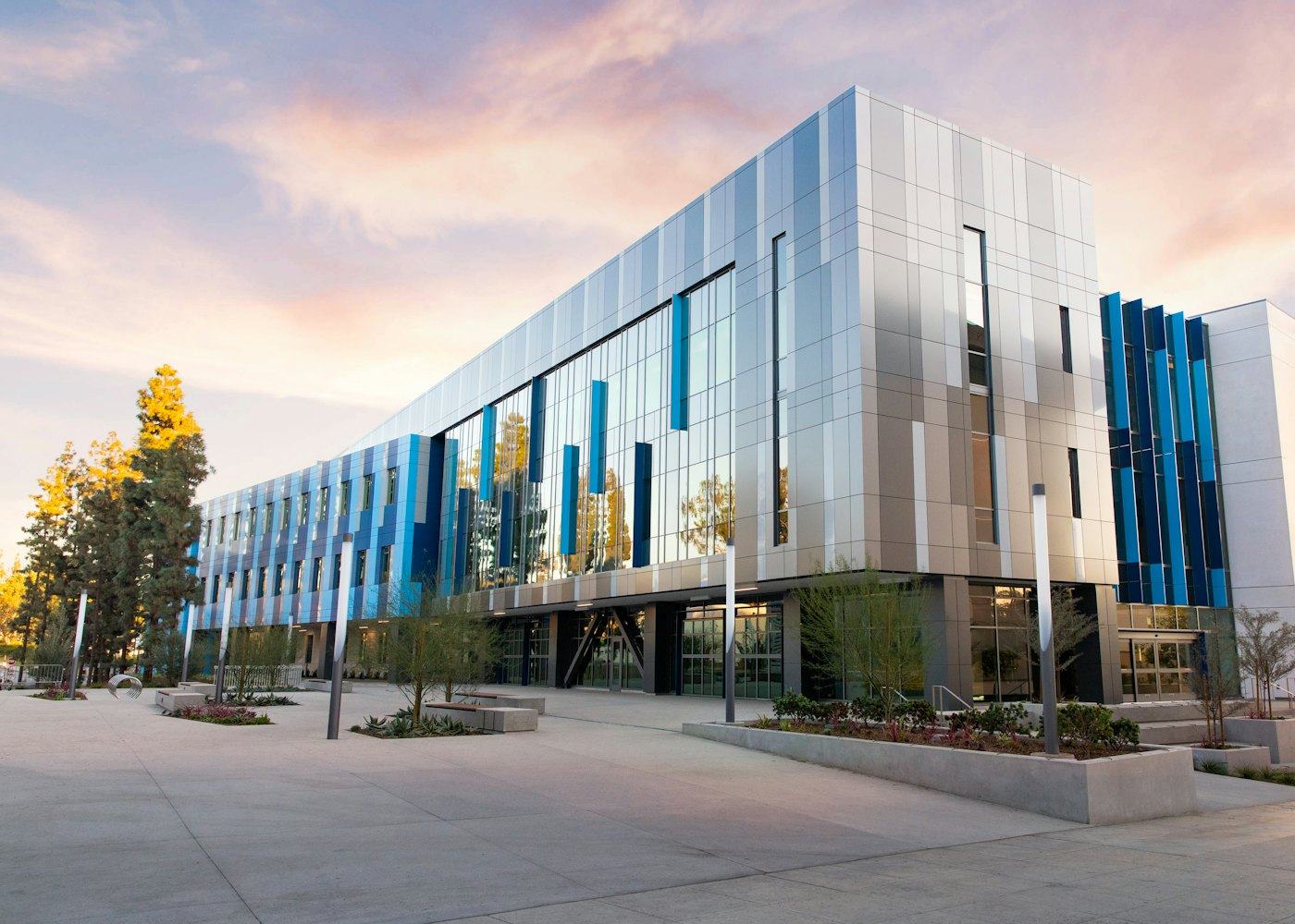 A modern commercial building with a glass and metal facade