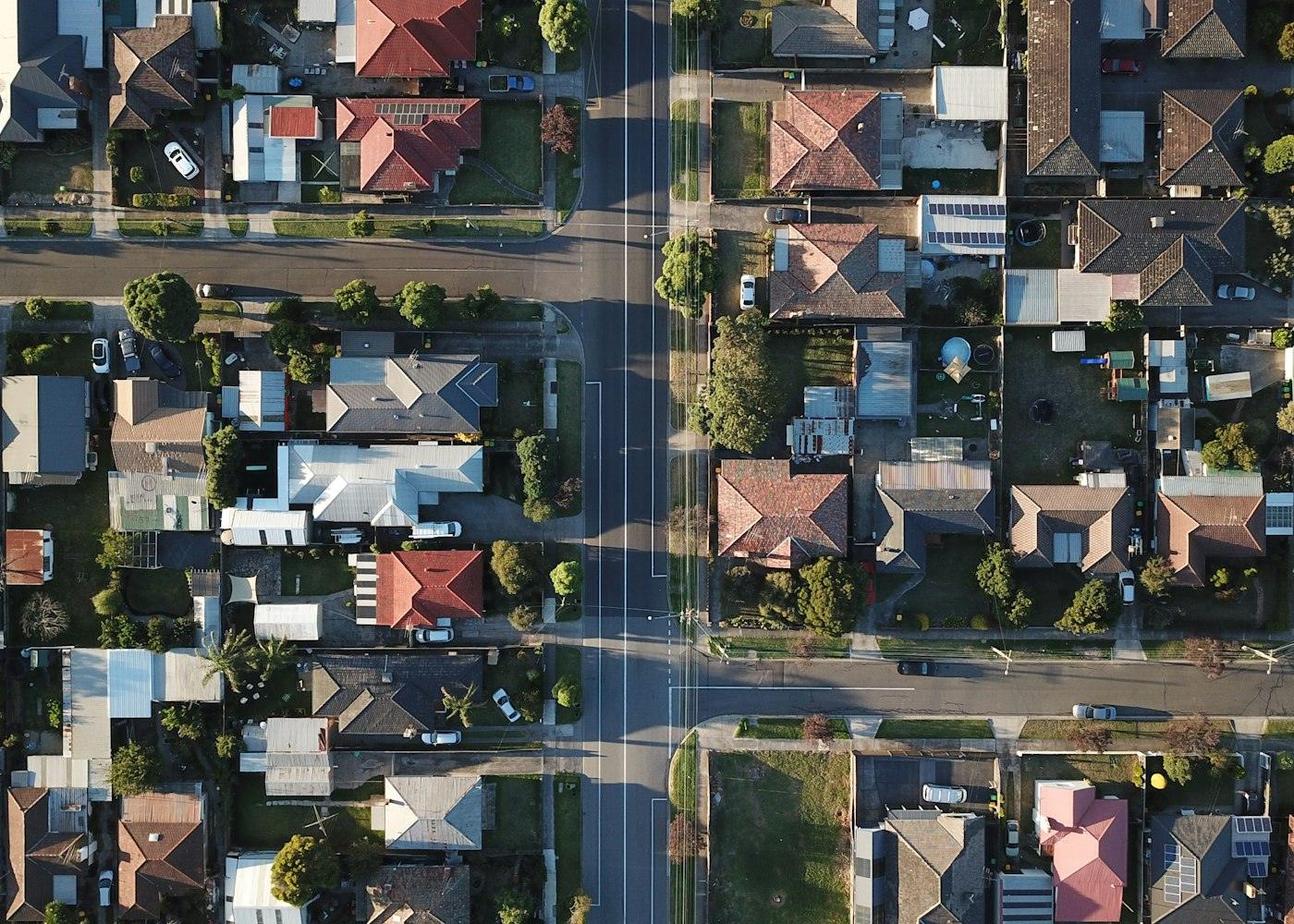 Looking straight down on a suburban street lined with homes