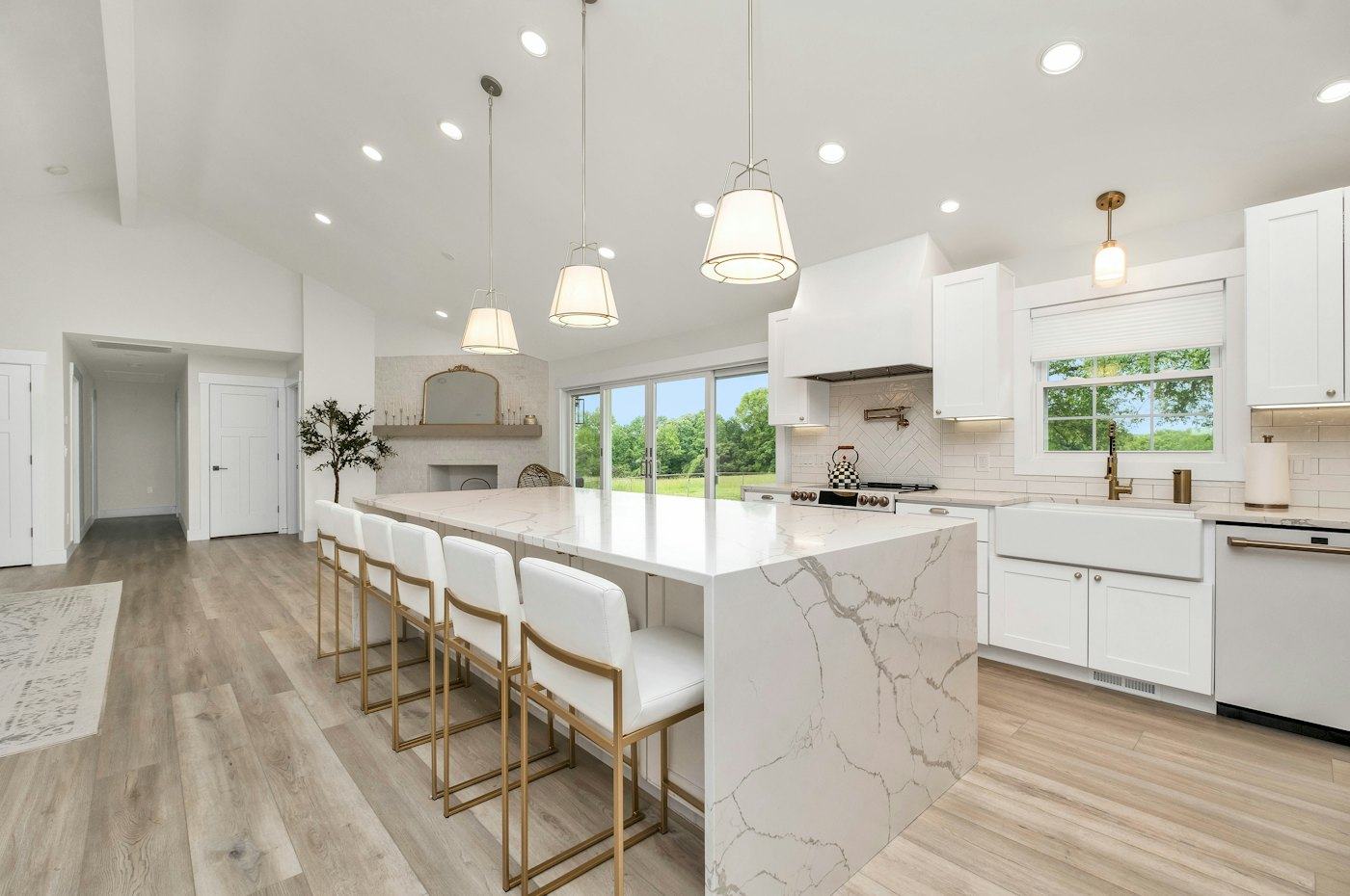 A bright modern kitchen with a marble island